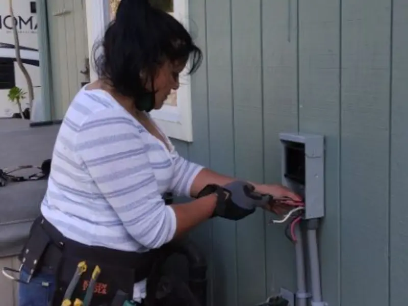 Licensed electrician wiring an exterior subpanel in Tuckahoe