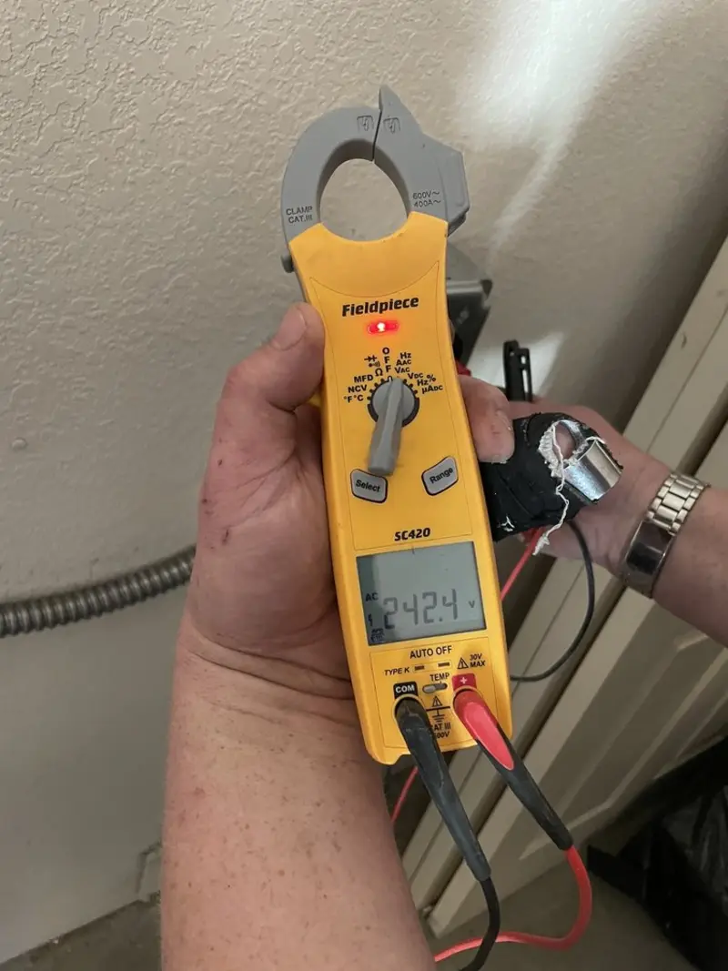 Voltage testing with clamp meter during Electrical Installation Services in Tuckahoe